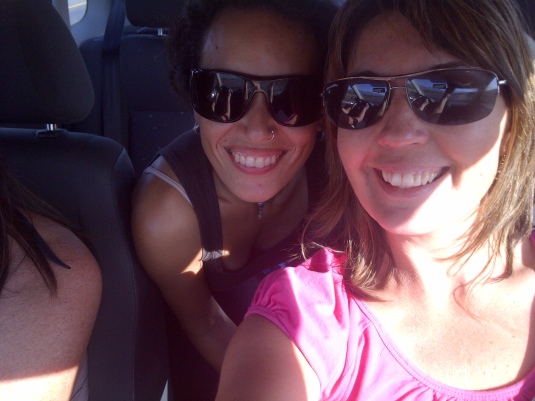 The girls in the car on a road trip with me to book our next bucket list adventure!