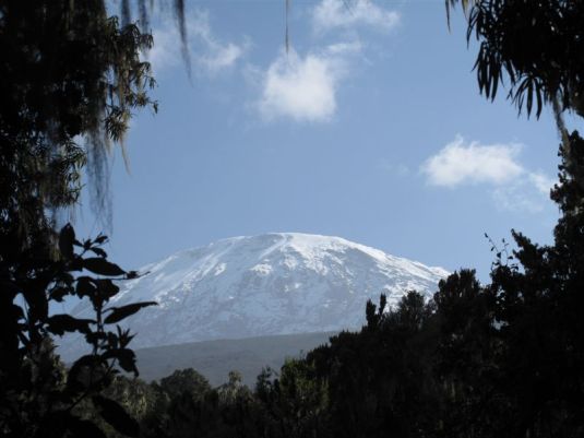 One of our last glimpses of the summit before leaving the slopes of Kilimanjaro. Standing there you couldn't help but smile knowing you had reached her peak! 