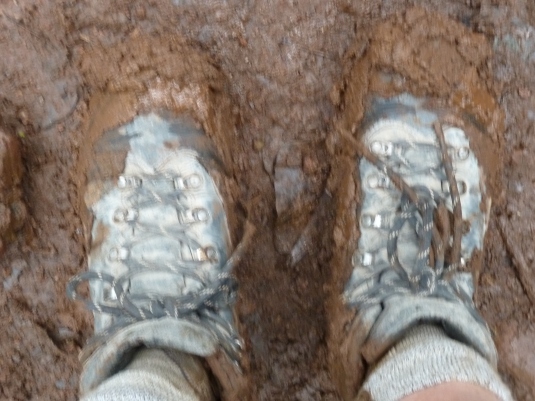 Judi's boots caked in mud, just like ours were! Photo by Judi Kurgan 