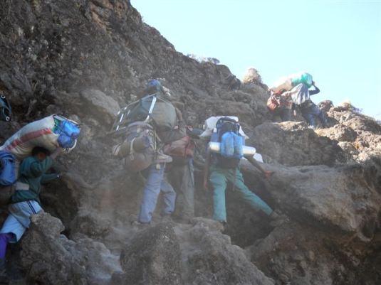 The porters, always carrying up incredible loads even up the great, vertical Barranco Wall! 